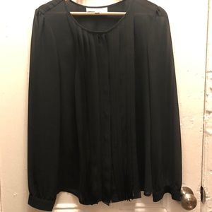 Sheer black blouse with pleats